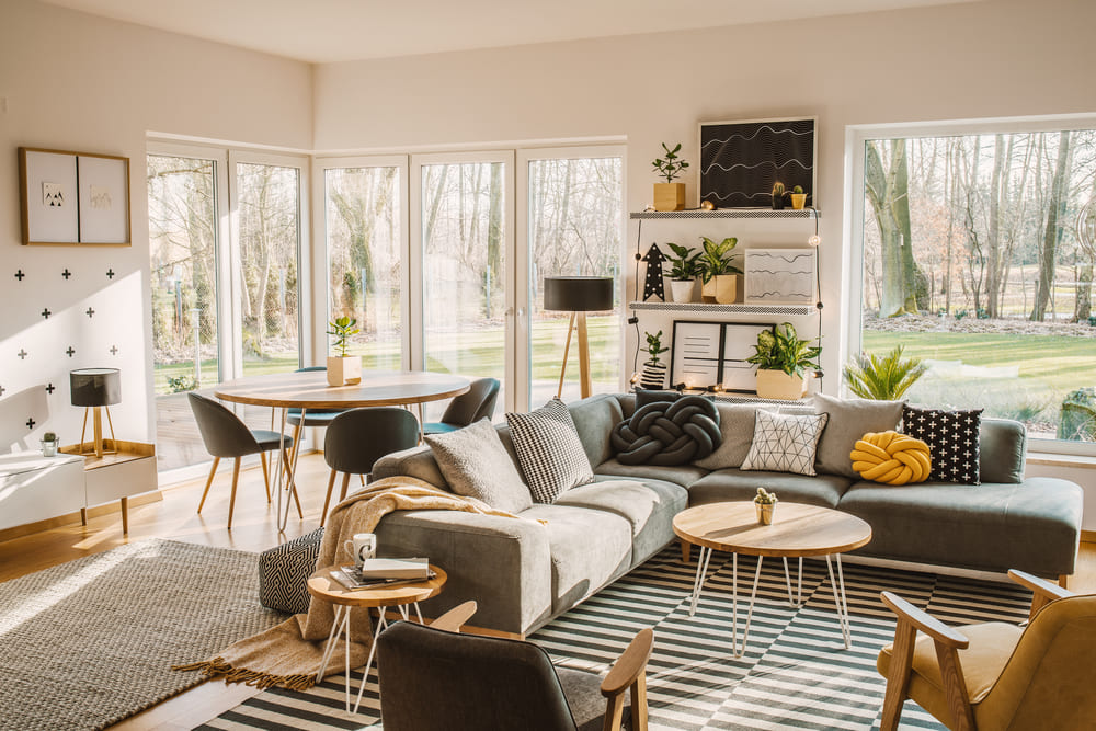 wooden-round-dining-table-in-the-corner-of-an-ope-2024-10-18-08-53-28-utc